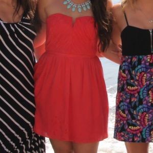 Adorable short dress in coral.